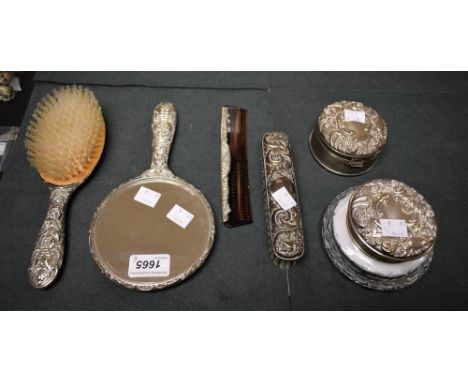 A lady's silver vanity set, Birmingham 1981; a cut glass powder jar with silver cover, Birmingham 1986; another, trinket box,