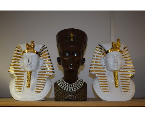 A pair of contemporary ceramic Egyptian masks; another, resin bust of Nefertiti (3)