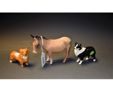 A Beswick model, of a Donkey, printed marks; others Corgi and Collie dogs (3)