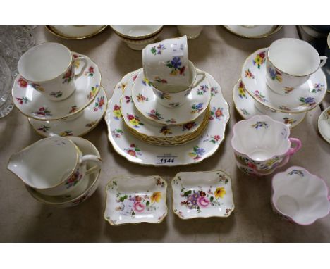 A set of three Shelley Wild Flowers pattern teacups, Dainty shape, pattern 13668; a Staffordshire Longton Vale floral printed