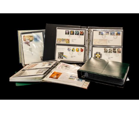 Stamp Interest - A Large Banana Style Box Containing Two A4 Stockbooks Full of GB First Day Covers, another featuring Benham 