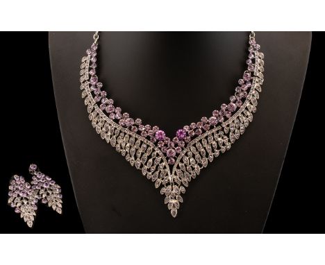 Purple Crystal Necklace and Drop Earrings Set, the background of both pieces formed as rows of small feathers, set with purpl