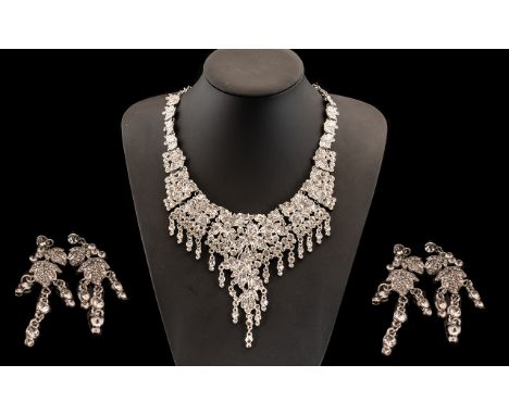 White Crystal Necklace and Earrings Set, the necklace formed from articulated panels with a foliage theme, the allover leaves