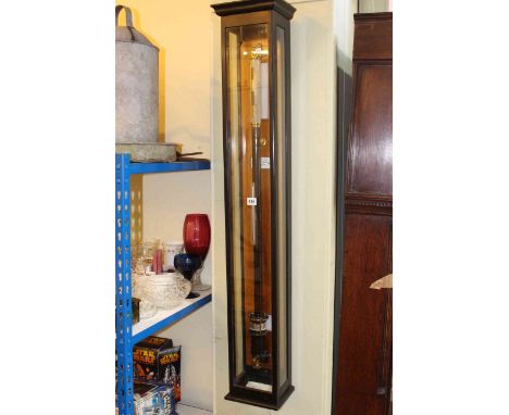 Late 19th Century marine barometer by Comitti &amp; Son, London in glazed ebonised case with enamelled back plate presented b