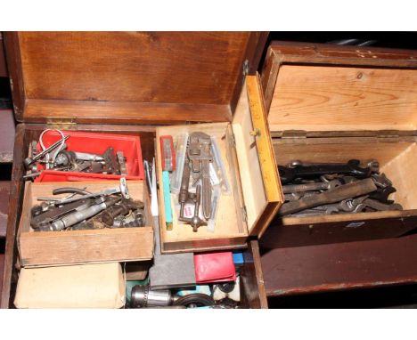 Two boxes containing spanners and engineering tools.