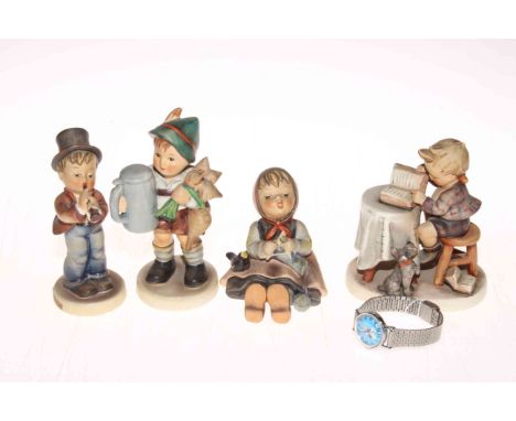 Four Hummel figurines and a 1958 Snoopy wristwatch.