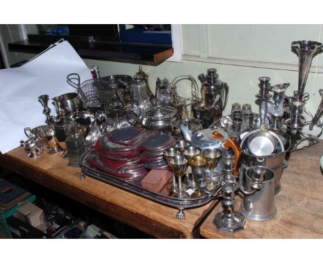 Collection of silver plated wares including teapots, cutlery, candelabra, serving tray.