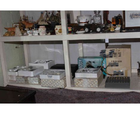 Atlas Editions model planes, motorcycle alarm clock, chess set, Typechoice Deluxe typewriter.