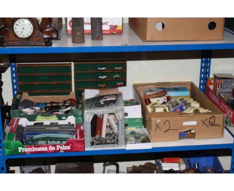 Full shelf of toys including model vehicles, airplanes, Star War toys, model railway, doll, etc.