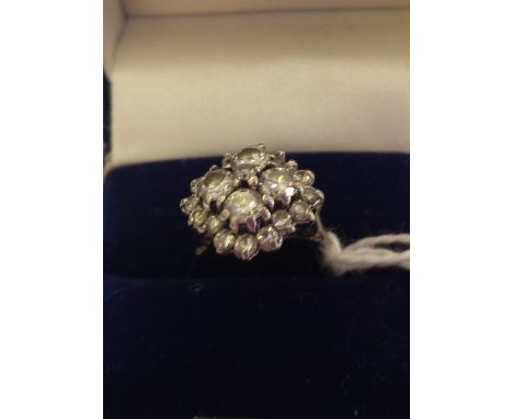 An 18ct. Diamond Cluster Ring. Size K.