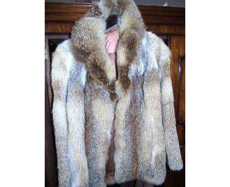 A Ladies Light Mink Fur Coat, half length.