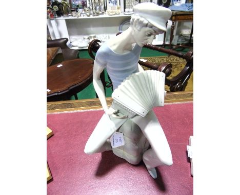 A Lladro Figure of a French Sailor Playing an Accordion. 34cm.