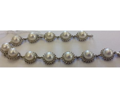 Amendment to Catalogue: A White Gold, Diamond and Pearl Set Bracelet (1).