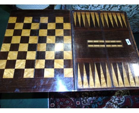 A 19th Century Walnut Games Table with fold-open chess board and cribbage top.