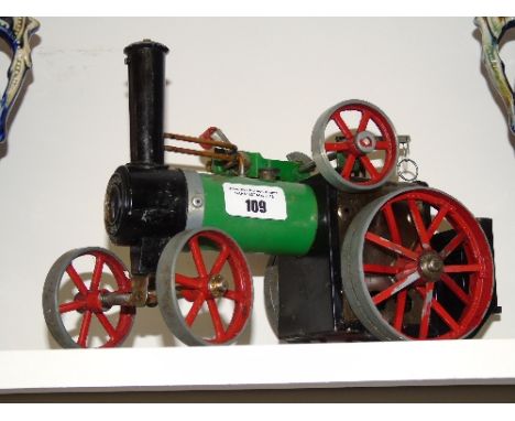 A Green 'Mamod' Model of a Traction Steam Engine.