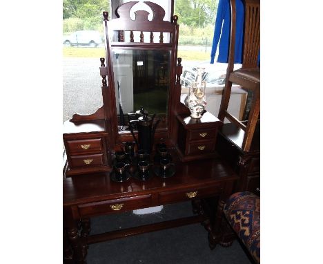 A Mahogany Dressing Table, 20th Century, with bevelled mirror flanked either side by two trinket drawers with brass handles, 