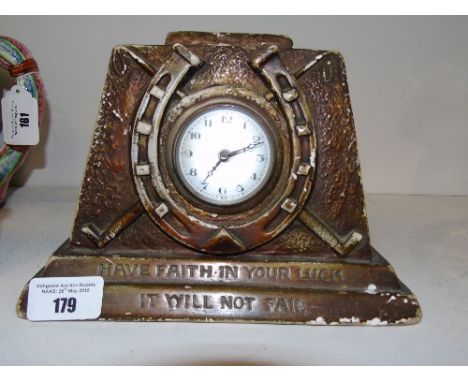 An Art Deco Mantle Clock, the clock face surrounded by a horseshoe.