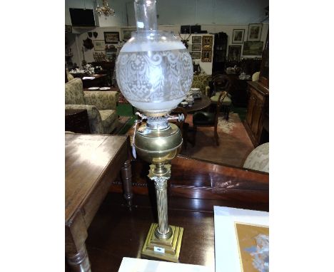 A Brass Oil Lamp, raised on a Corinthian column and stepped square base.