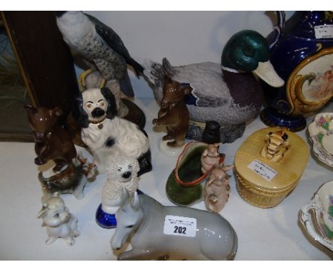 A Large Quantity of Ceramic Animals to include a Beswick spaniel, a large resin duck etc. 