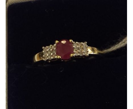 A 9ct. Gold Diamond and Ruby Cluster Ring. Size K.