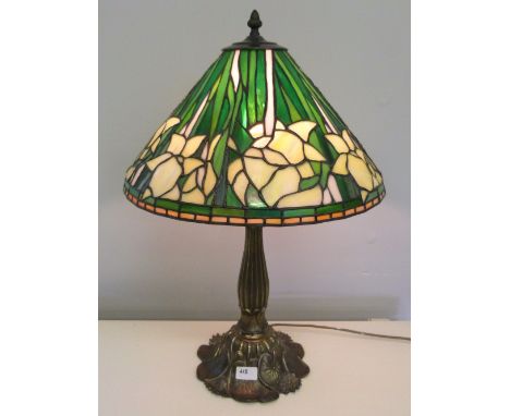 A brass based Tiffany style table lamp