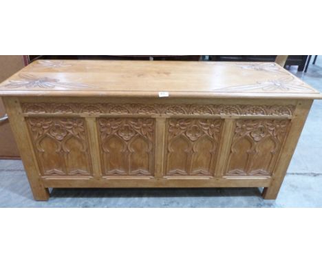 A joined light oak carved blanket chest. 54½' wide