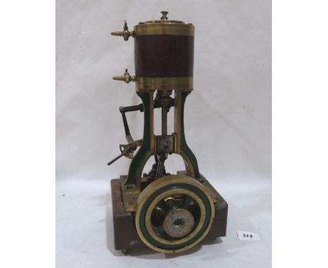 A brass reciprocating single cylinder gas engine. 15' high