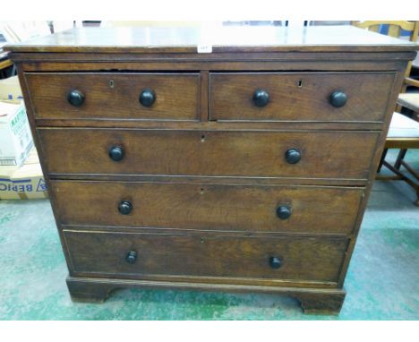 A 19th century oak chest of two short over three long drawers on bracket feet. 45' wide 
