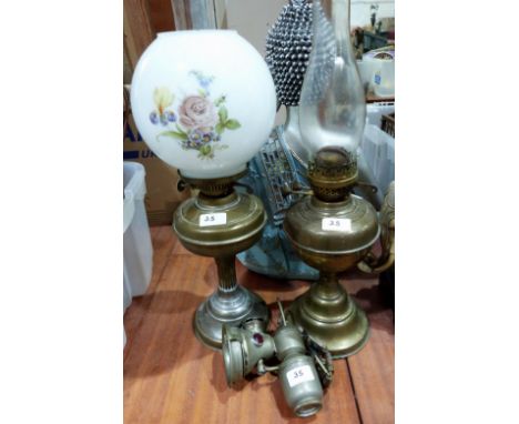 Two brass oillamps and an acetylene bicycle lamp
