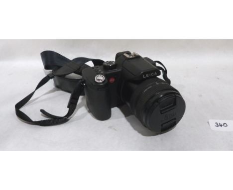 A Leica V-Lux I digital camera with charger, soft carrying case and SD cards