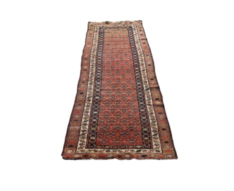 A NORTH WEST PERSIAN RUNNER, CIRCA 1930. 322cm by 104cmProvenance: The Keith Schellenberg Collection.