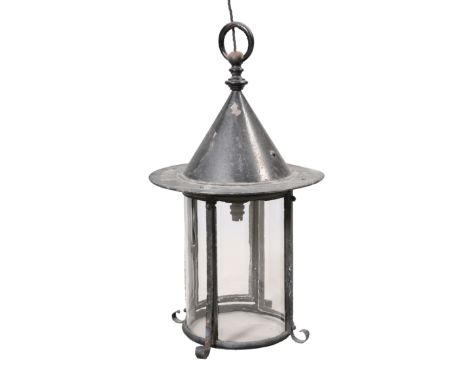 A LARGE ARTS AND CRAFTS "WITCHES HAT" IRON LANTERN, c.1900, of circular section with four curved glass panels. Height to hang