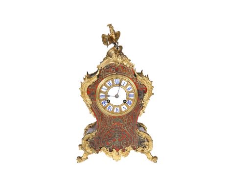 A 19TH CENTURY GILT-METAL MOUNTED BOULLE MANTEL CLOCK, the waisted case with acanthus cast mounts and surmounted by a cockere