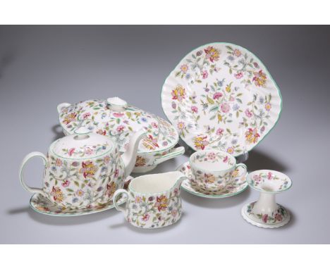 A COLLECTION OF MINTON "HADDON HALL" TABLE WARES, comprising teapot, tureen, cream jug, two oval plates, oval dish, cake plat