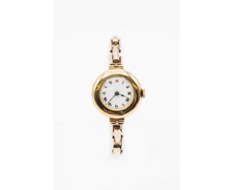 A LADY'S VINTAGE BRACELET WATCH. Circular white enamel dial with black index and blued steel hands, case measures 26mm and ha