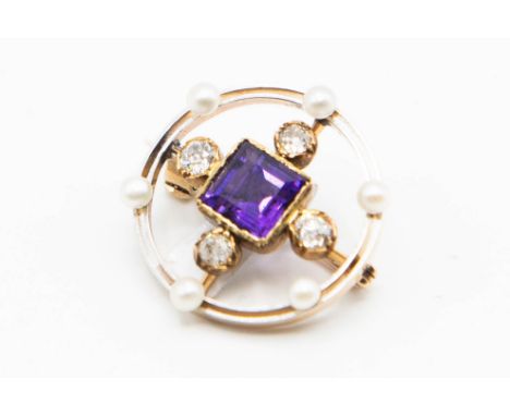 AN AMETHYST, DIAMOND AND SEED PEARL BROOCH, circa 1910-1920, the roundel brooch set to the perimeter with six evenly spaced s