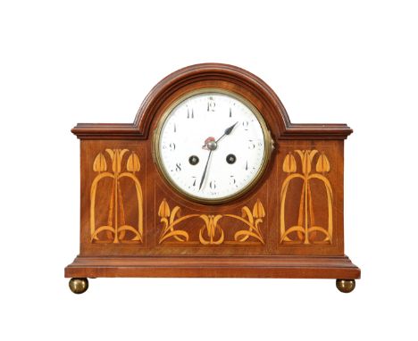AN ART NOUVEAU INLAID MAHOGANY MANTEL CLOCK, IN THE MANNER OF SHAPLAND &amp; PETTER, the white enamel dial with Arabic numera