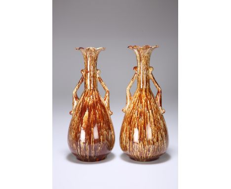 A PAIR OF LINTHORPE POTTERY TWO-HANDLED VASES, with mottled ground, nos. 1839, impressed marks. 28cm high