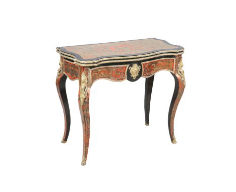 A NAPOLEON III GILT-METAL MOUNTED BOULLE FOLDOVER CARD TABLE, of serpentine outline, the frieze centred by a mask, the legs s