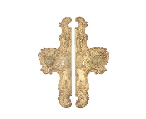 A PAIR OF 19TH CENTURY BRASS DOOR PLATES, each cast with scrolling acanthus and putto playing a tambourine, the handles decor