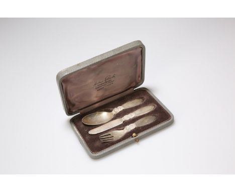 A GEORG JENSEN SILVER CHRISTENING SET, IMPORT MARK FOR LONDON 1935, comprising spoon, knife and fork, in a box labelled Frede