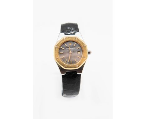 A LADY'S AUDEMARS PIGUET ROYAL OAK STRAP WATCH. Circular grey textured dial with gilt hands, baton index and date window to 3