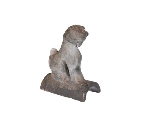 A CHINESE EARTHENWARE RIDGE TILE, the arch surmounted by a Qilin. 24cm high