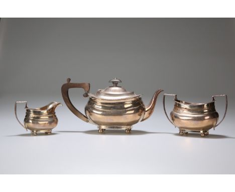 AN EDWARDIAN SILVER THREE-PIECE TEA SERVICE, JOHN &amp; WILLIAM F DEAKIN, SHEFFIELD 1905, in Regency style, with gadrooned bo