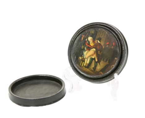 A 19TH CENTURY EROTIC LACQUER SNUFF BOX, circular, the inner cover decorated with an erotic scene. Diameter 8.5cm