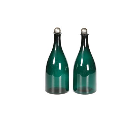 A PAIR OF EARLY 19TH CENTURY GREEN GLASS FLASK DECANTERS WITH SILVER-MOUNTED STOPPERS, the domed stoppers marked for Peter, A
