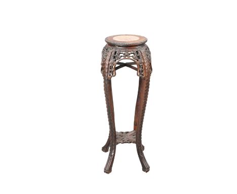 A CHINESE MARBLE-INSET HARDWOOD PLANTSTAND, c.1900, the stand with leaf-carved circular top, carved and pierced with foliage,