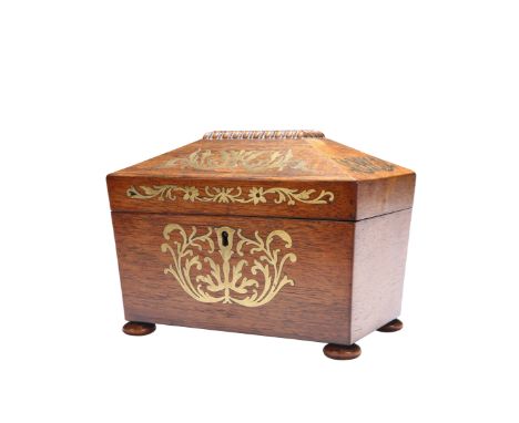 A REGENCY BRASS INLAID ROSEWOOD TEA CADDY, of sarcophagus form, raised on flattened bun feet. 16cm high, 20.5cm wide, 13cm de