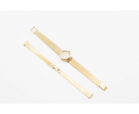 A LADY'S 18CT GOLD GIRARD PERREGAUX WATCH AND AN 18CT GOLD WATCH BRACELET. Circular silver dial with gilt baton index and han