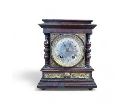 A late Victorian oak eight day mantel clock, striking on a coiled gong, height 26.5cm. Condition - fair, wear and oxidisation
